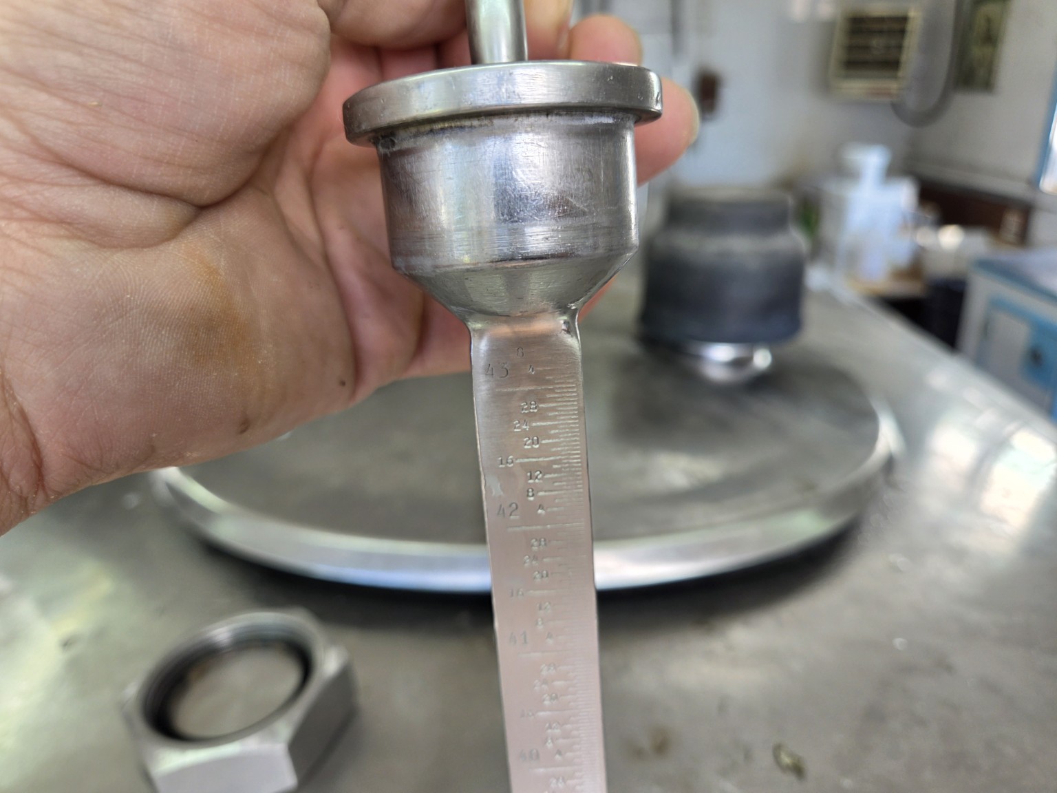 Graduated gauge used to measure the volume of milk in a bulk tank